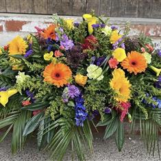 Vibrant casket spray 