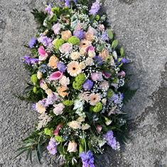 Pastel shades Casket spray  