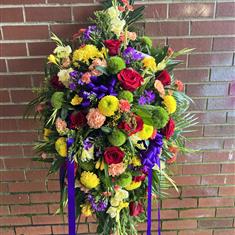 Vibrant standing casket spray 