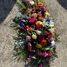 Vibrant mixed casket tribute 